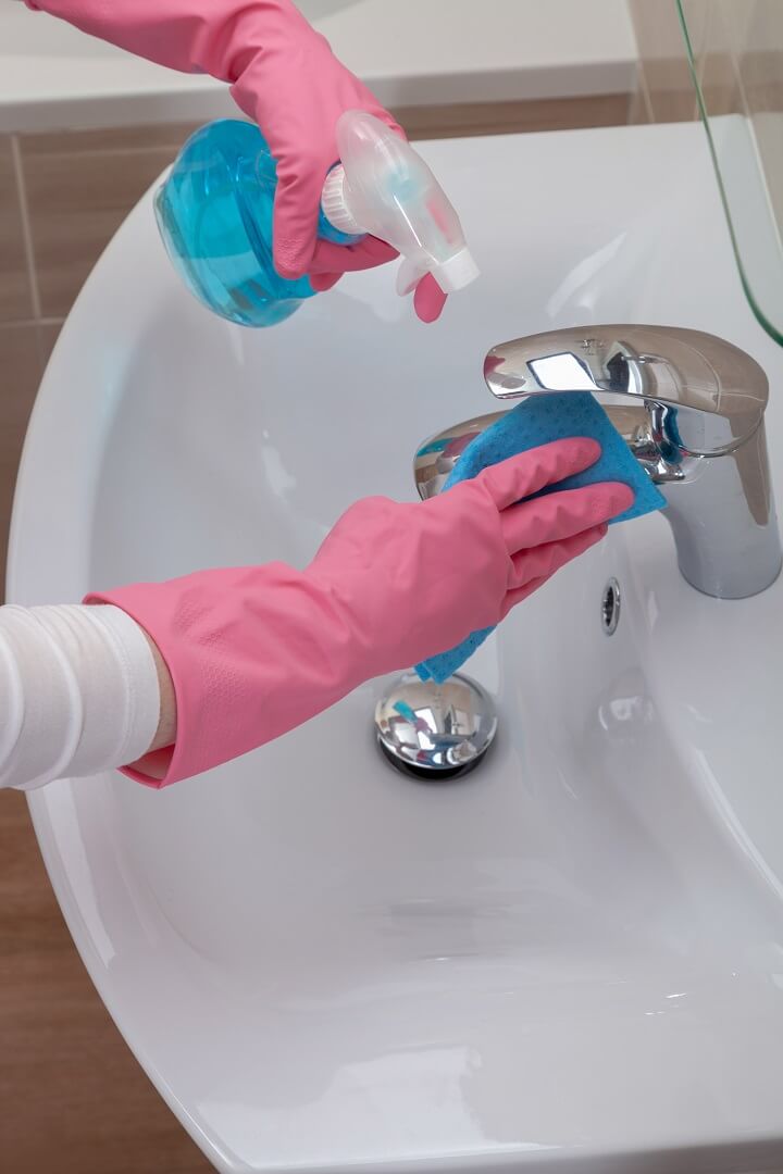 Rubber Gloves Cleaning Bathroom Sink