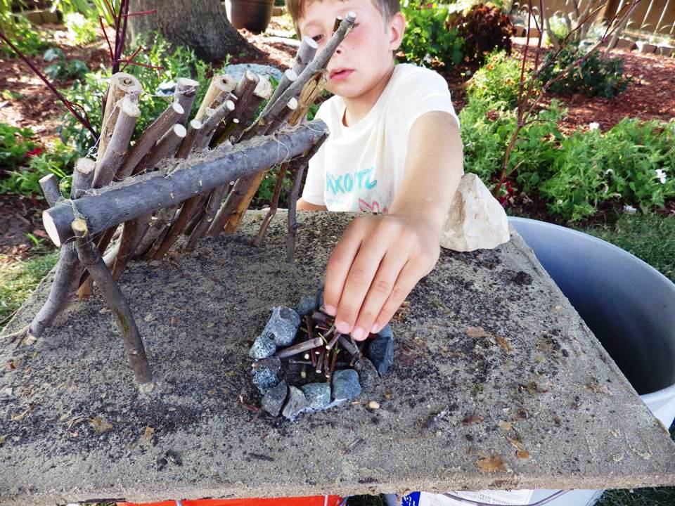 BOY BUILDING MINIATURE FIRE