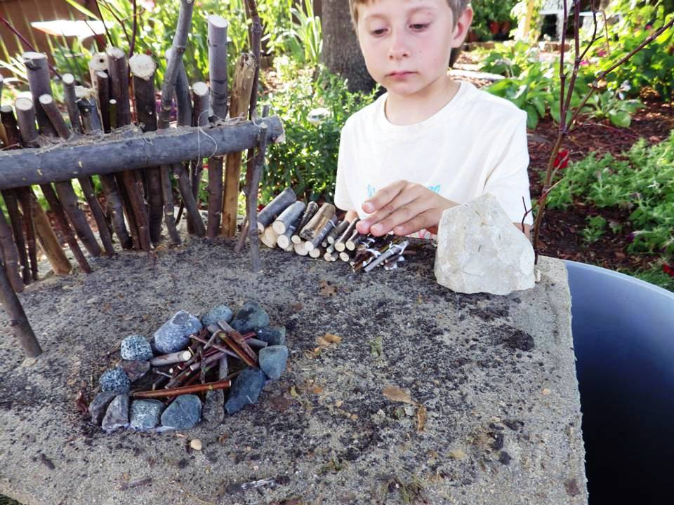 BOY WORKING ON FIREWOOD