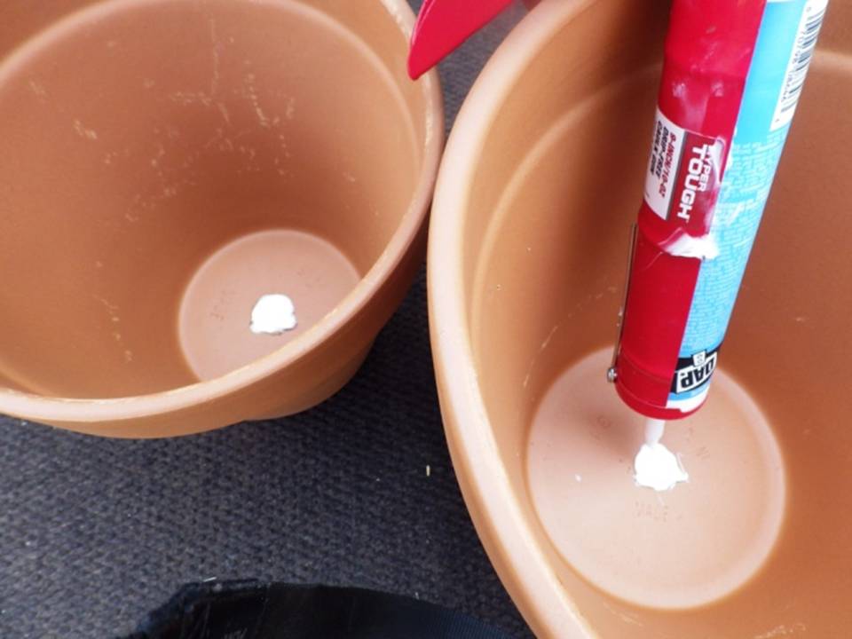 CAULKING FLOWER POT HOLES