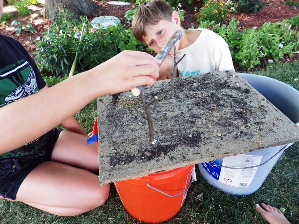 KIDS WORKING ON MINIATURE