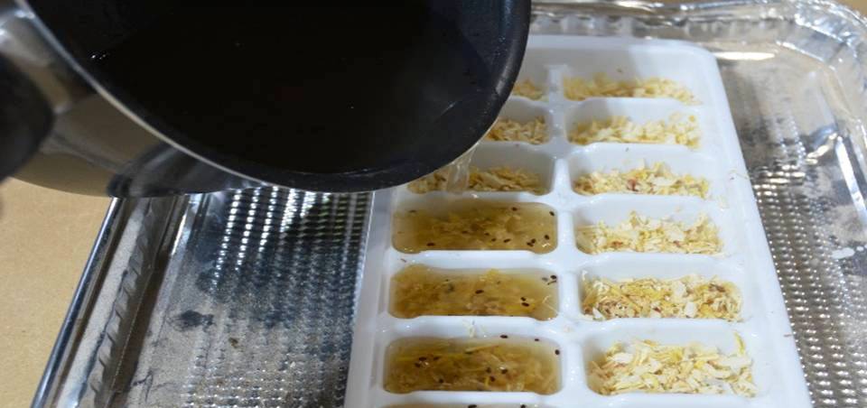 POURING WAX INTO ICE CUBE TRAYS