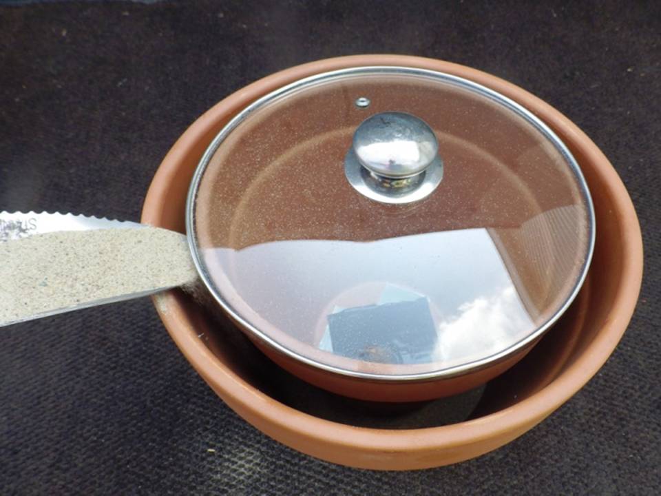 SHOVEL SAND INTO POT