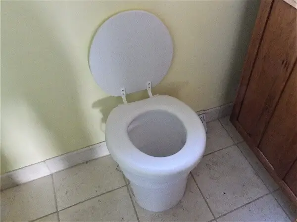 Bucket Toilet in Bathroom
