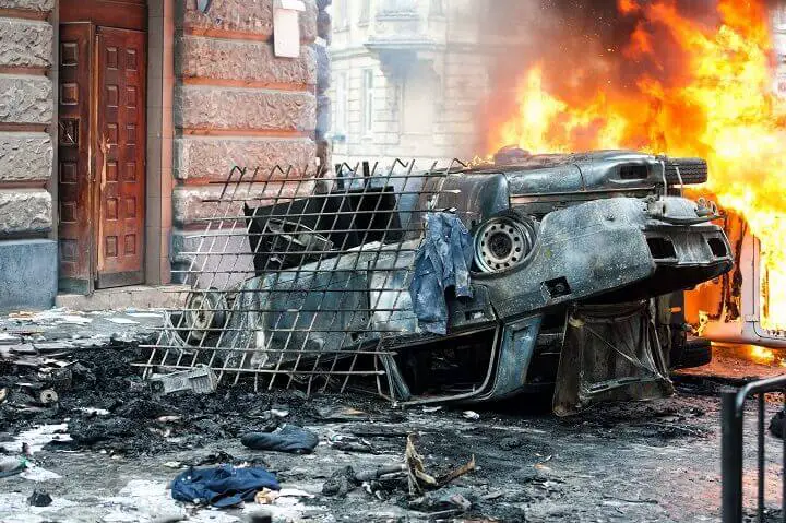 Burning Car Destroyed In Riot