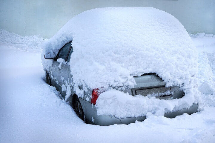 Car Under a Pile of Snow