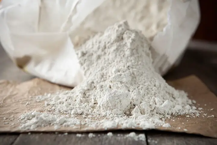 Diatomaceous Earth Pouring Out Of Bag
