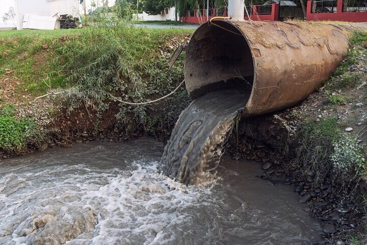 Dirty Sewage Pouring From Pipe