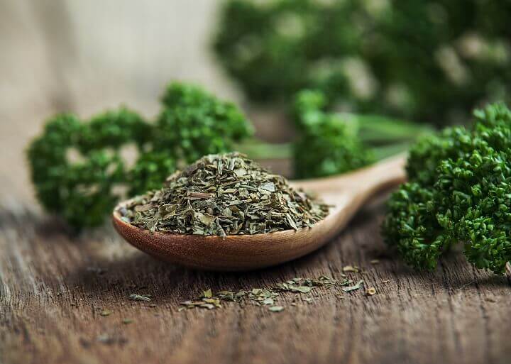 Dried Parsley On Wooden Spoon