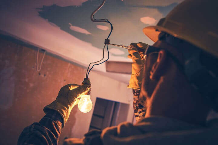 Electrician Fixing Light