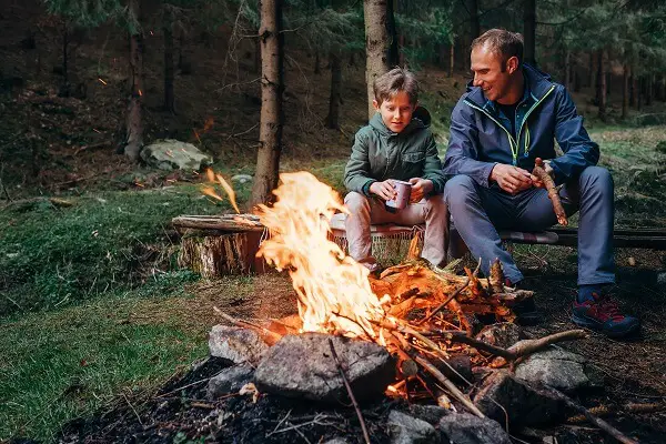 Father and Son by Campfire