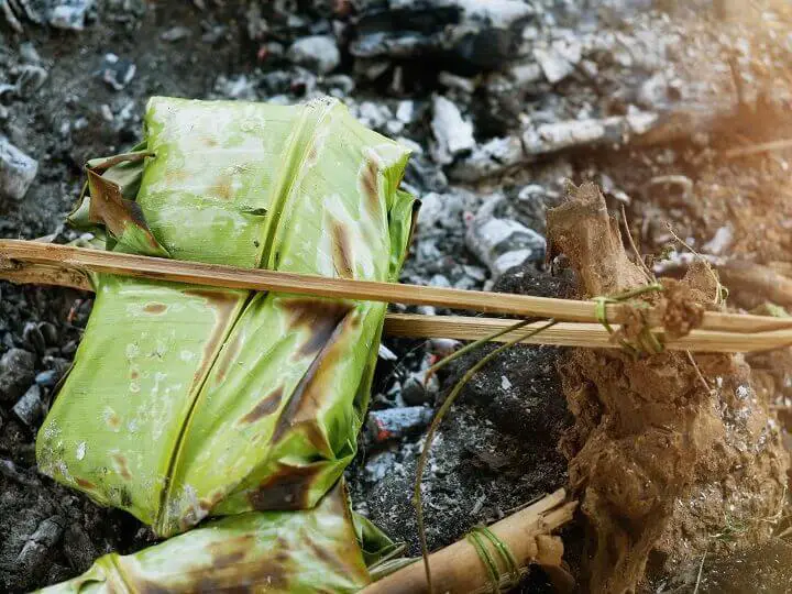 Food Wrapped in Banana Leaves on Fire