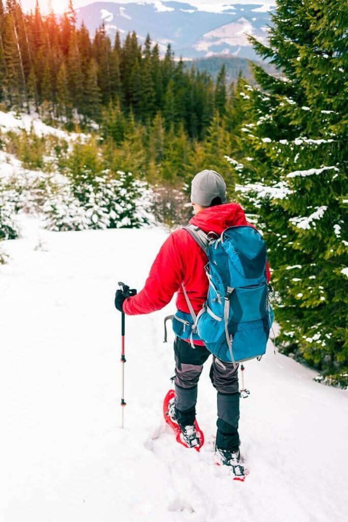 Man Hiking In Winter Snow