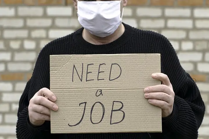 Man Holding Need-A-Job Sign