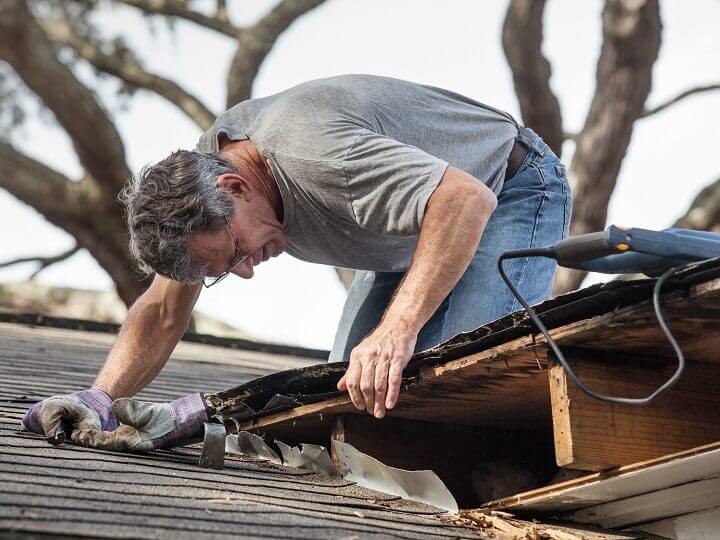 Man Repairing Roof