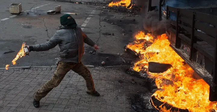 Man Throwing Molotov Cocktail