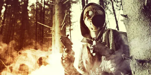 Man With Survival Guns and Gas Mask