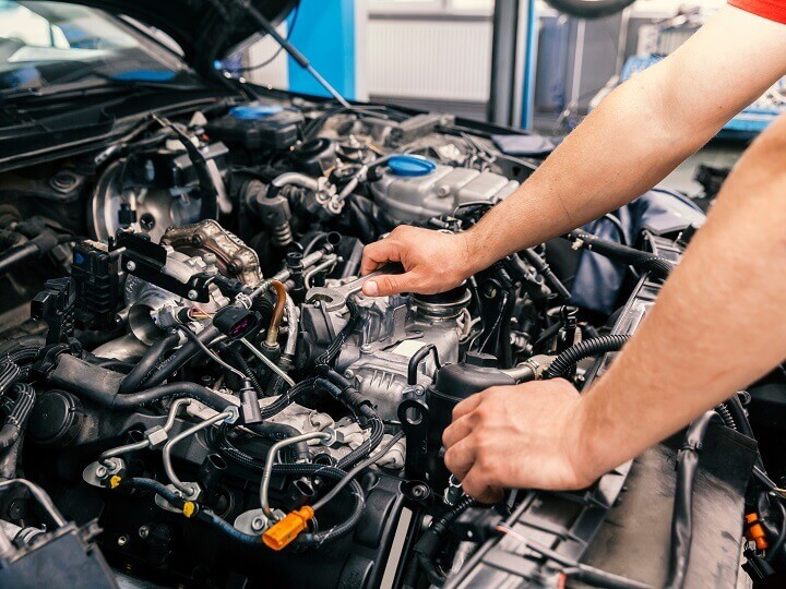 Mechanic Repairing Car