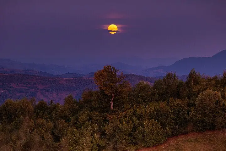 Moon Rising Over Beautiful Landscape