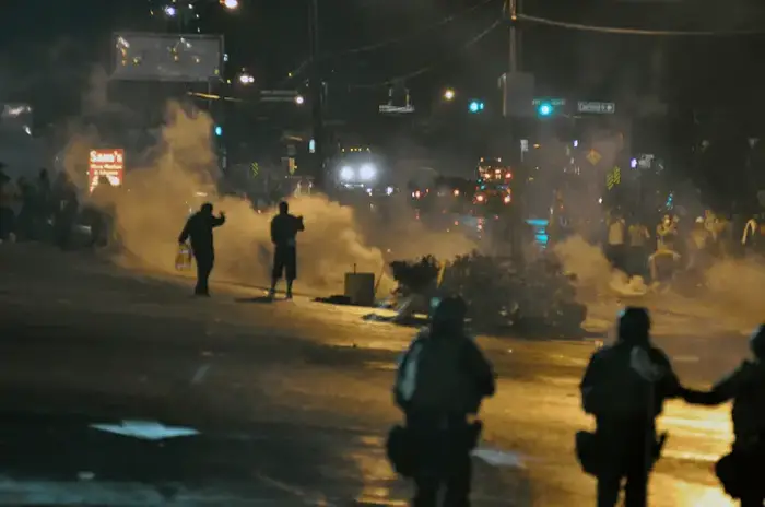 Police Tear Gas In Streets At Night