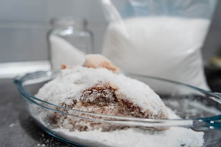 Raw Meat Covered With Salt in a Bowl