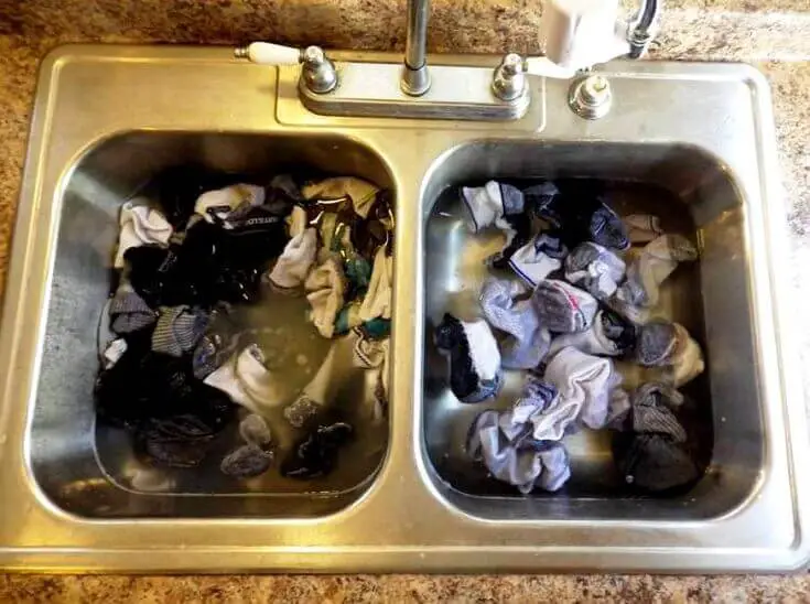 Rinsing Clothes In Sink