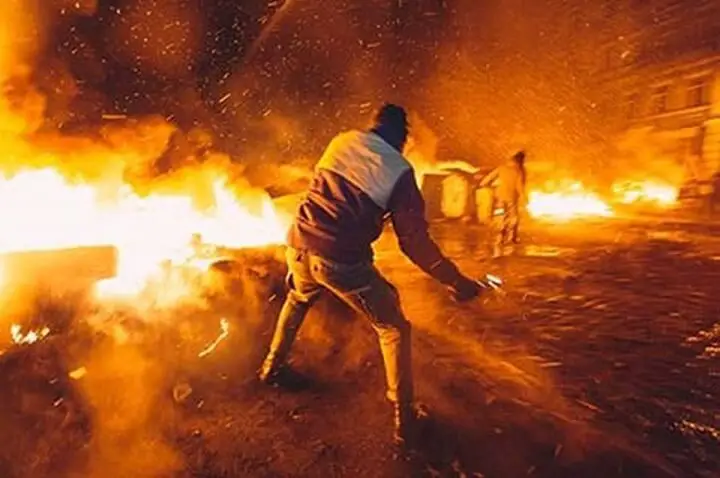 Rioters in Street With Fire