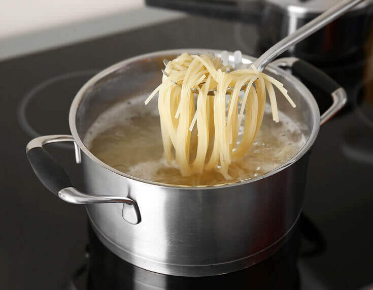 Spaghetti in Scoop over Boiling Water