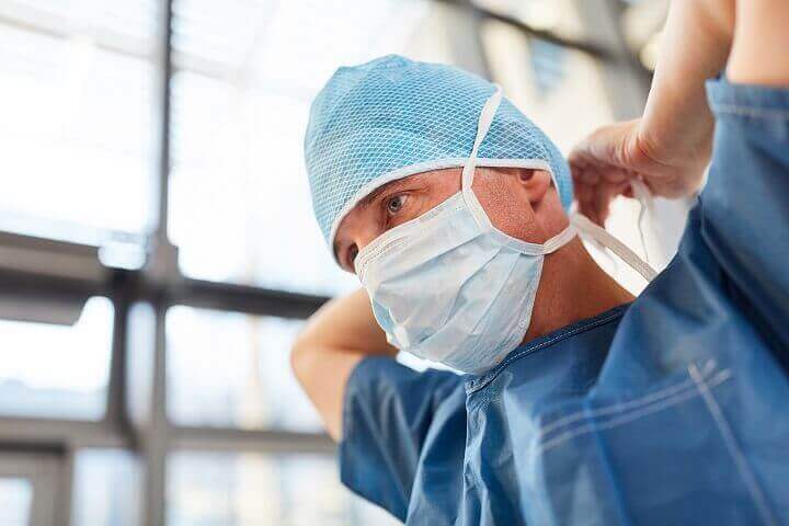 Surgeon Putting on Mask