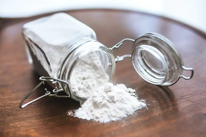 White Flour Spilling From Jar